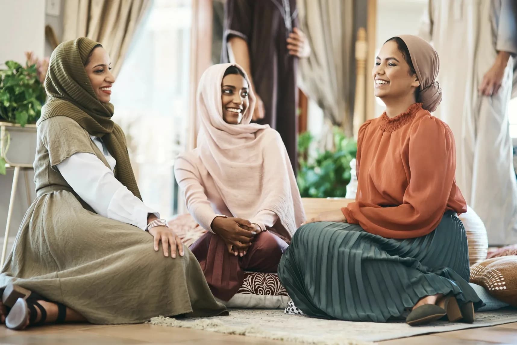 Three women sharing a warm and thoughtful conversation