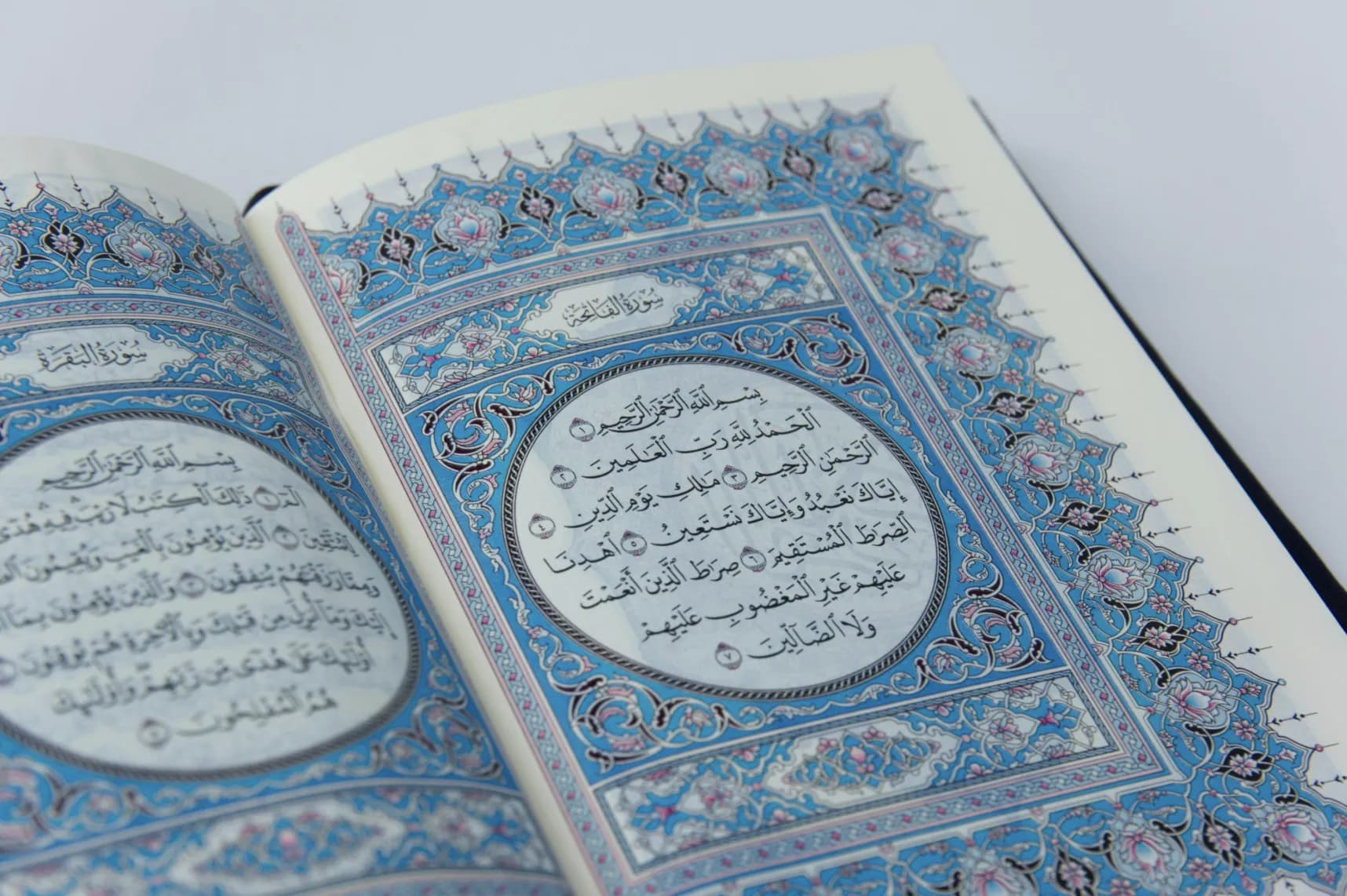 An open Qur’an in warm natural light